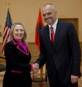US Secretary of State Hillary Clinton shakes hands with Albanian Socialist Party Chief Edi Rama prior to a meeting in Tirana, Albania, Thursday, Nov. 1, 2012. Hillary Clinton arrived in EU-hopeful Albania on the last leg of her Balkans tour where she is expected to urge opposing political sides to work together to push through reforms demanded by Brussels. (AP Photo/Saul Loeb, Pool)